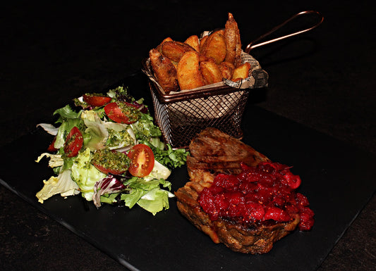 Beef steak (well-done) with salad, side dishes and sauce of your choice