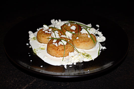 Cottage cheese pancakes with goat cheese, sour cream and pesto sauce