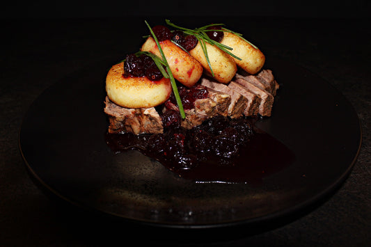Cottage cheese pancakes with beef steak and cherry jam