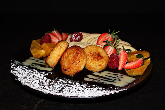 Cottage cheese pancakes with condensed milk, fruits and berries