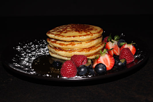 American pancakes with maple syrup and berries