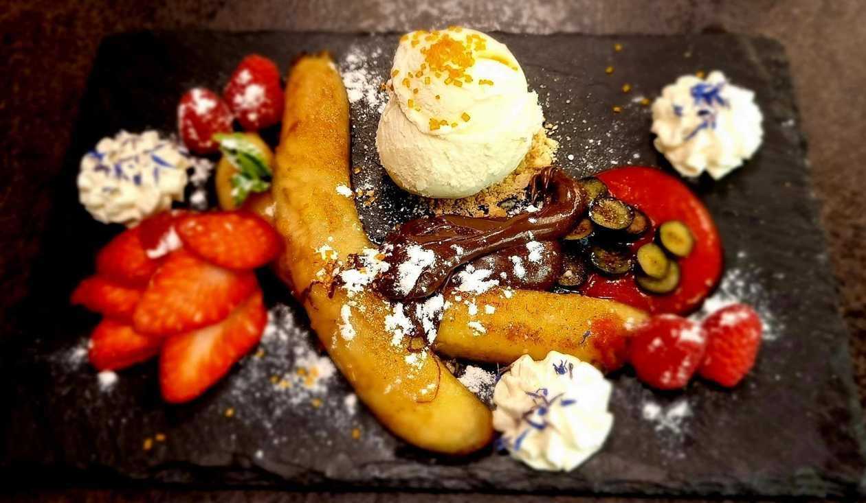 Caramelized banana with ice cream and chocolate cream